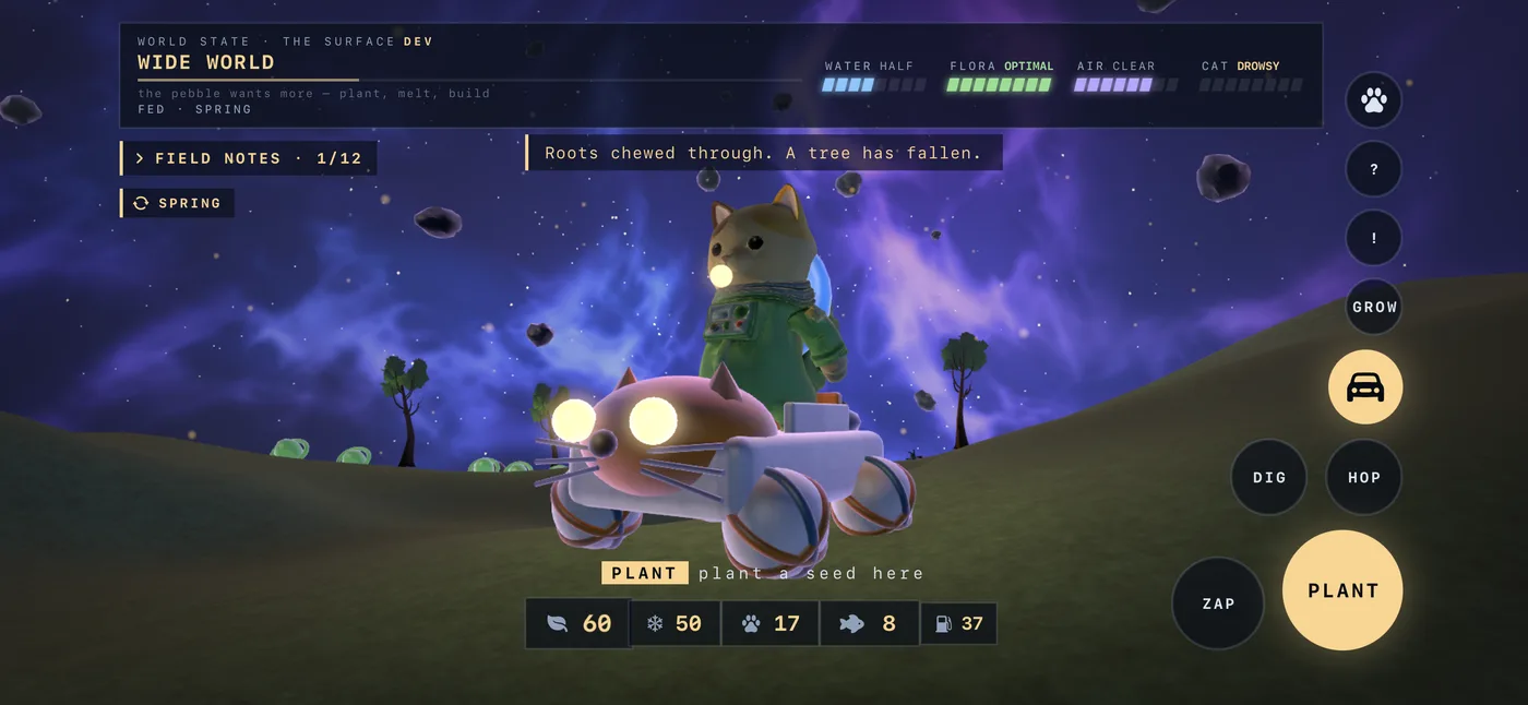 The cat driving a scrap-built rover across green ground, the world state reading Wide World.